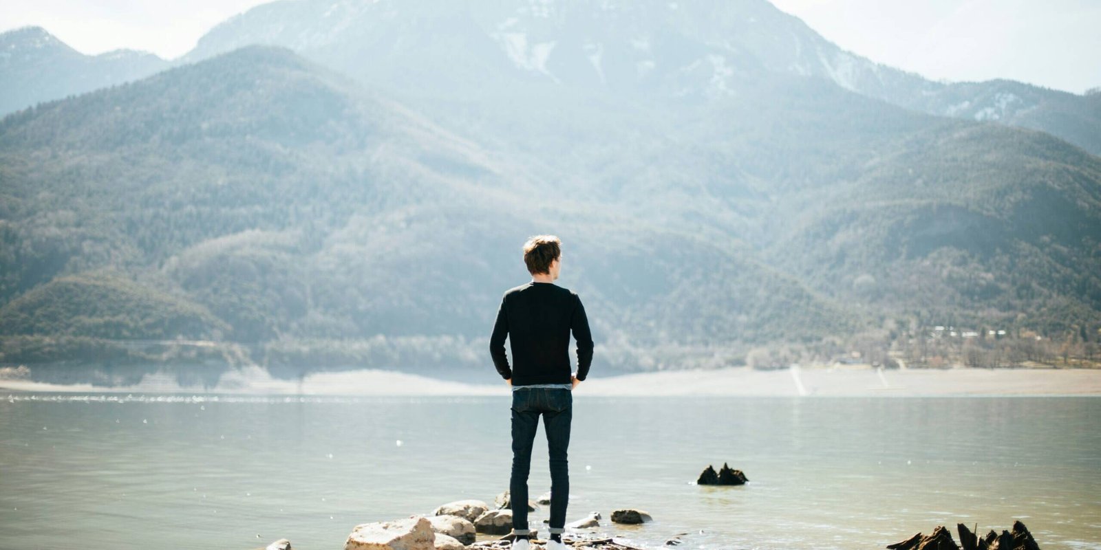 man looking out to the mountains